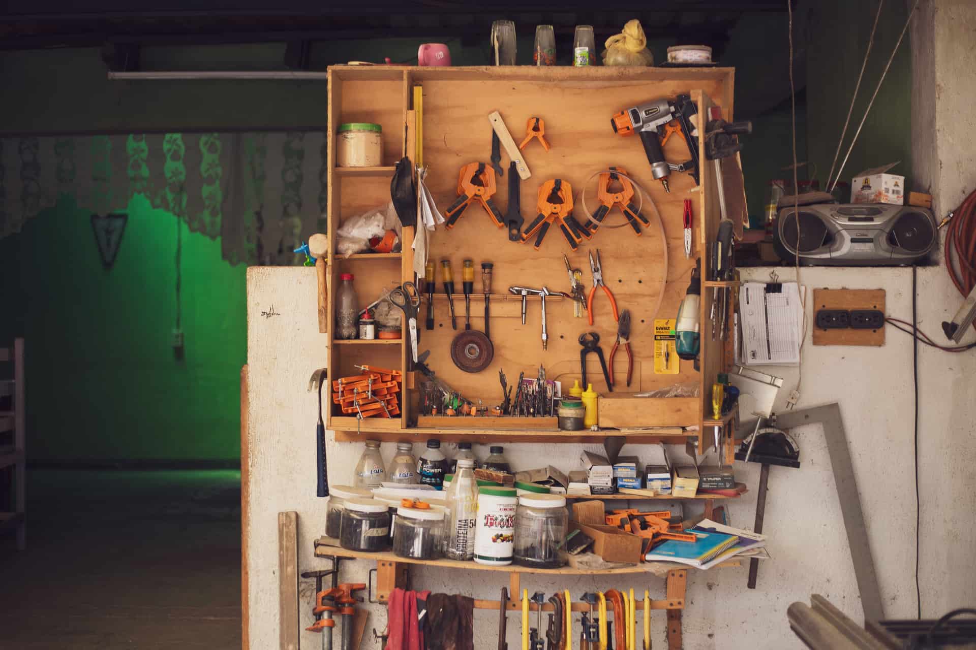 A workbench with glue and carpentry tools