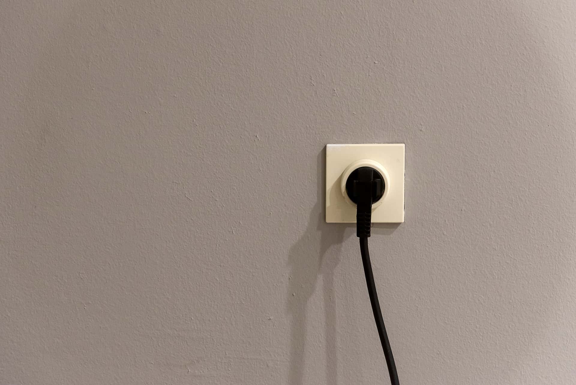 A plug and wall socket, illustrating electrical safety